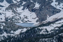 Just minutes from Whistling Moose Lodge, Rocky Mountain National Park offered breathtaking views like this frozen alpine lake nestled in the snow-covered peaks. A short drive led to a whole world of high-altitude wonder.