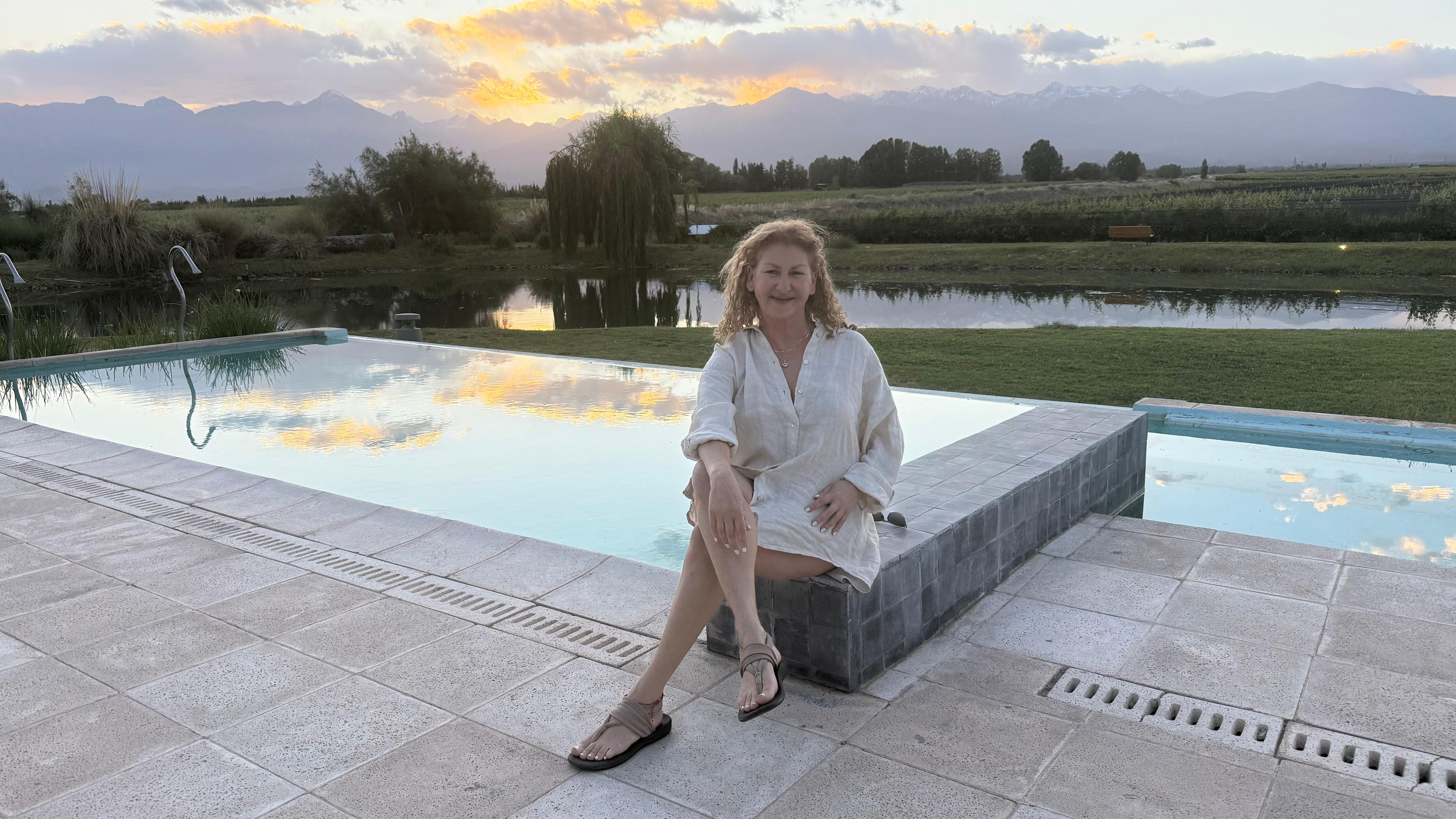 Sitting by the pool.
