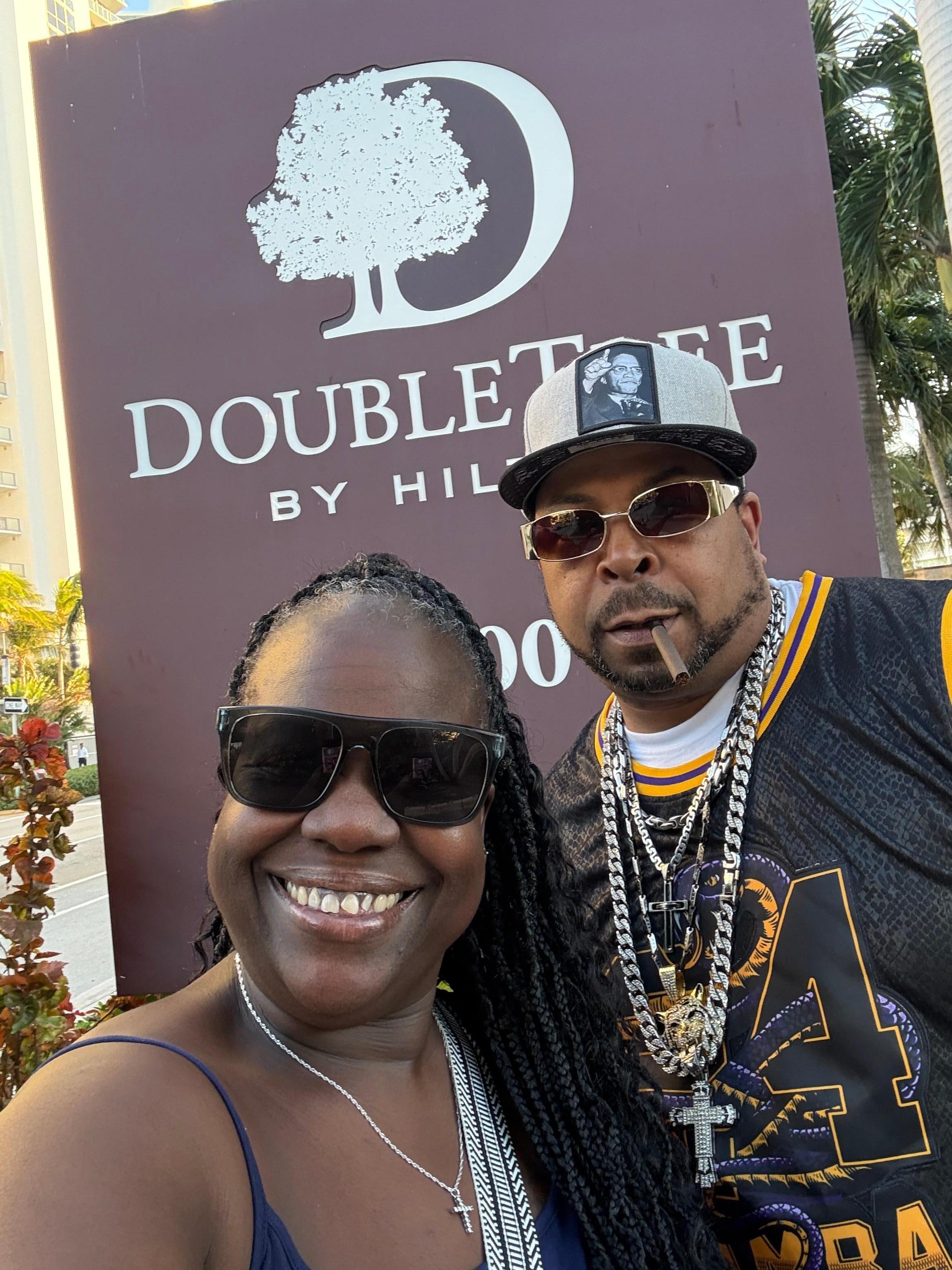 Selfie in front of the Hilton Logo