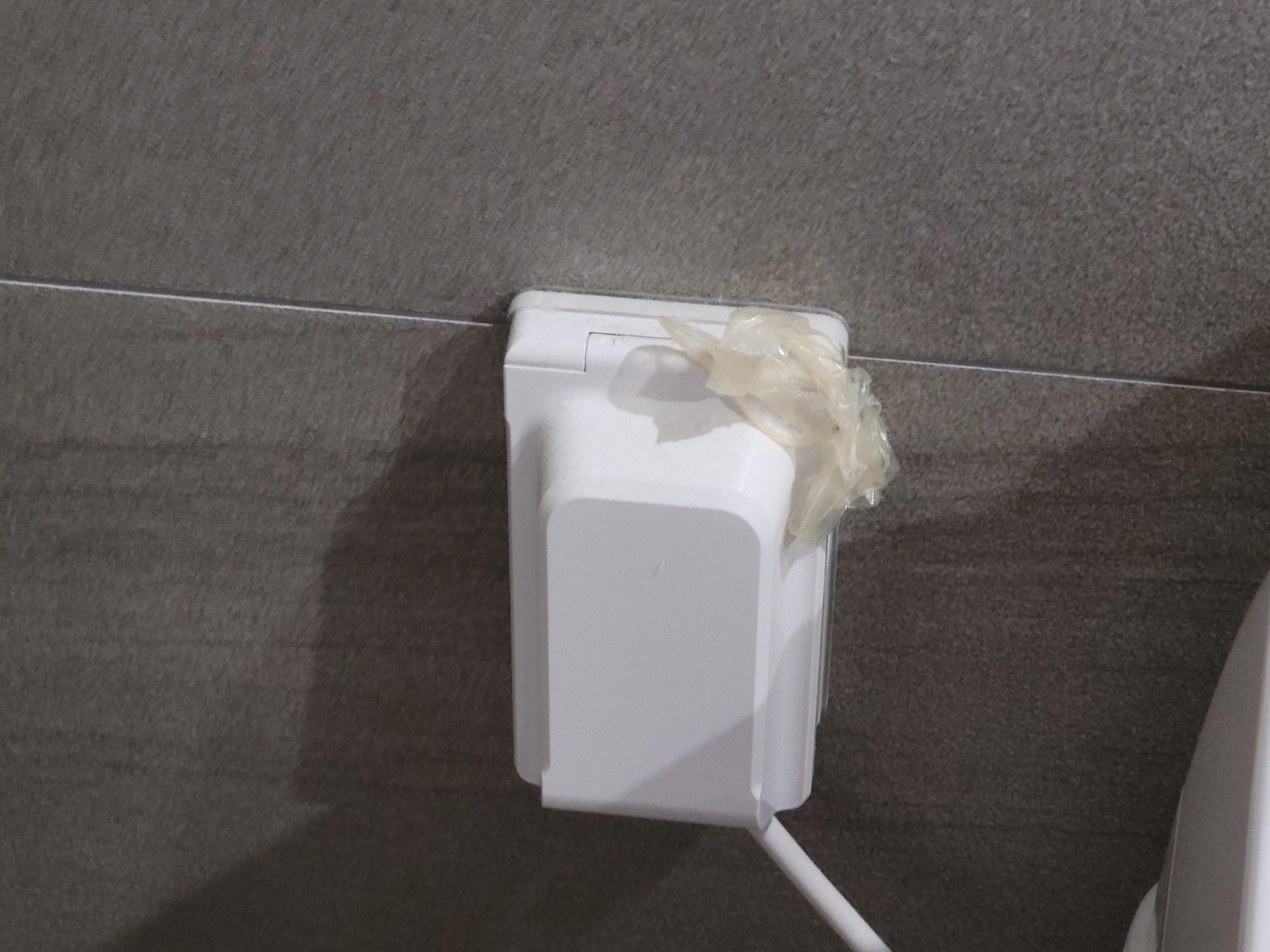Used condom on the electrical outlet cover 2