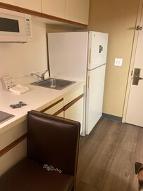 Having a kitchen in the room is nice.