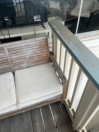 Patio furniture has mold and railings dirt.