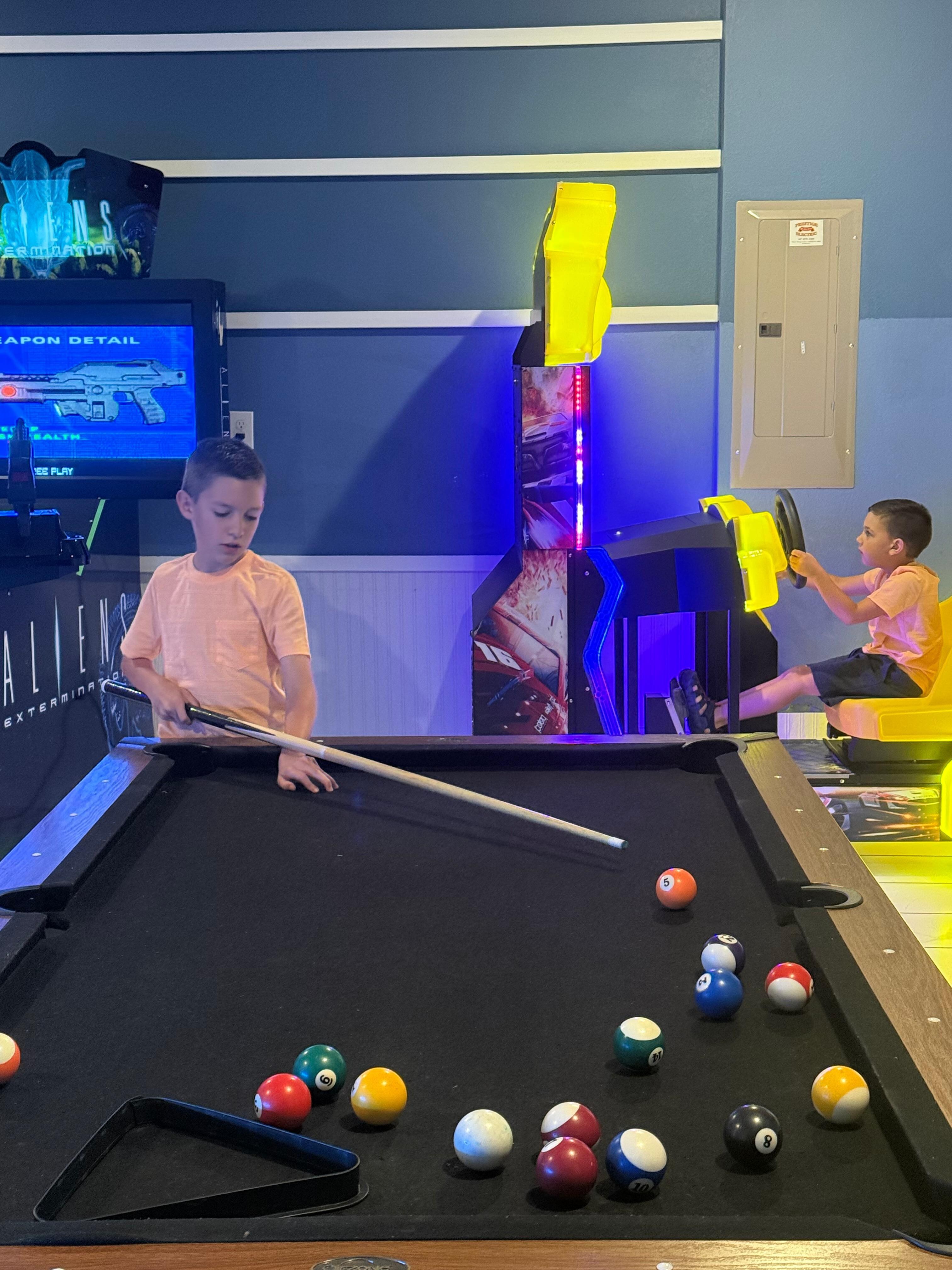5 and 7 year-old enjoying game room!