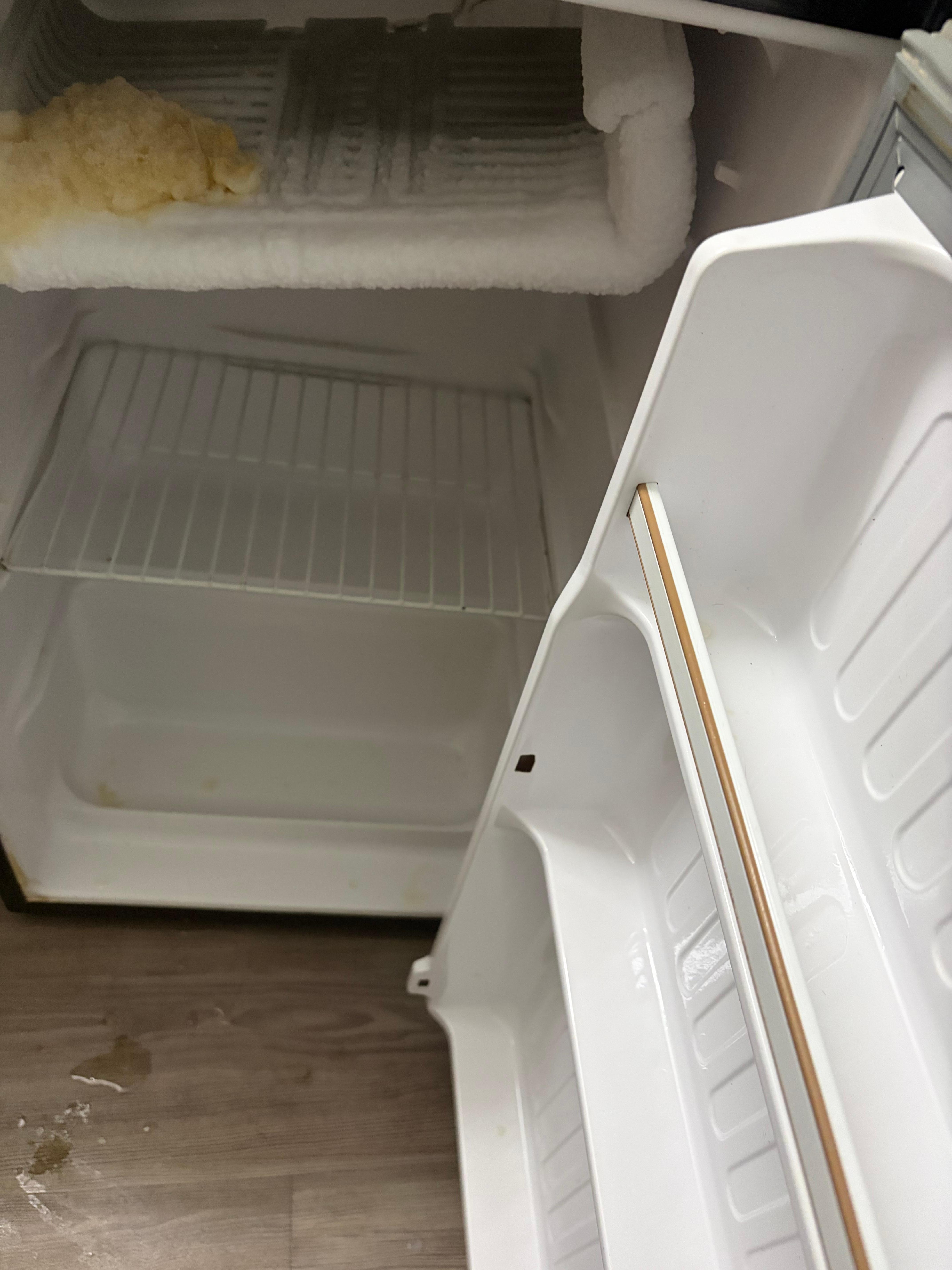 Nasty fridge with broke freezer shelf