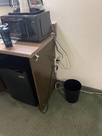 Exposed electrical cables and power strip