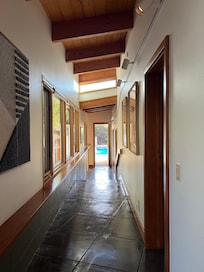 Lovely view down the hallway looking out at the pool.