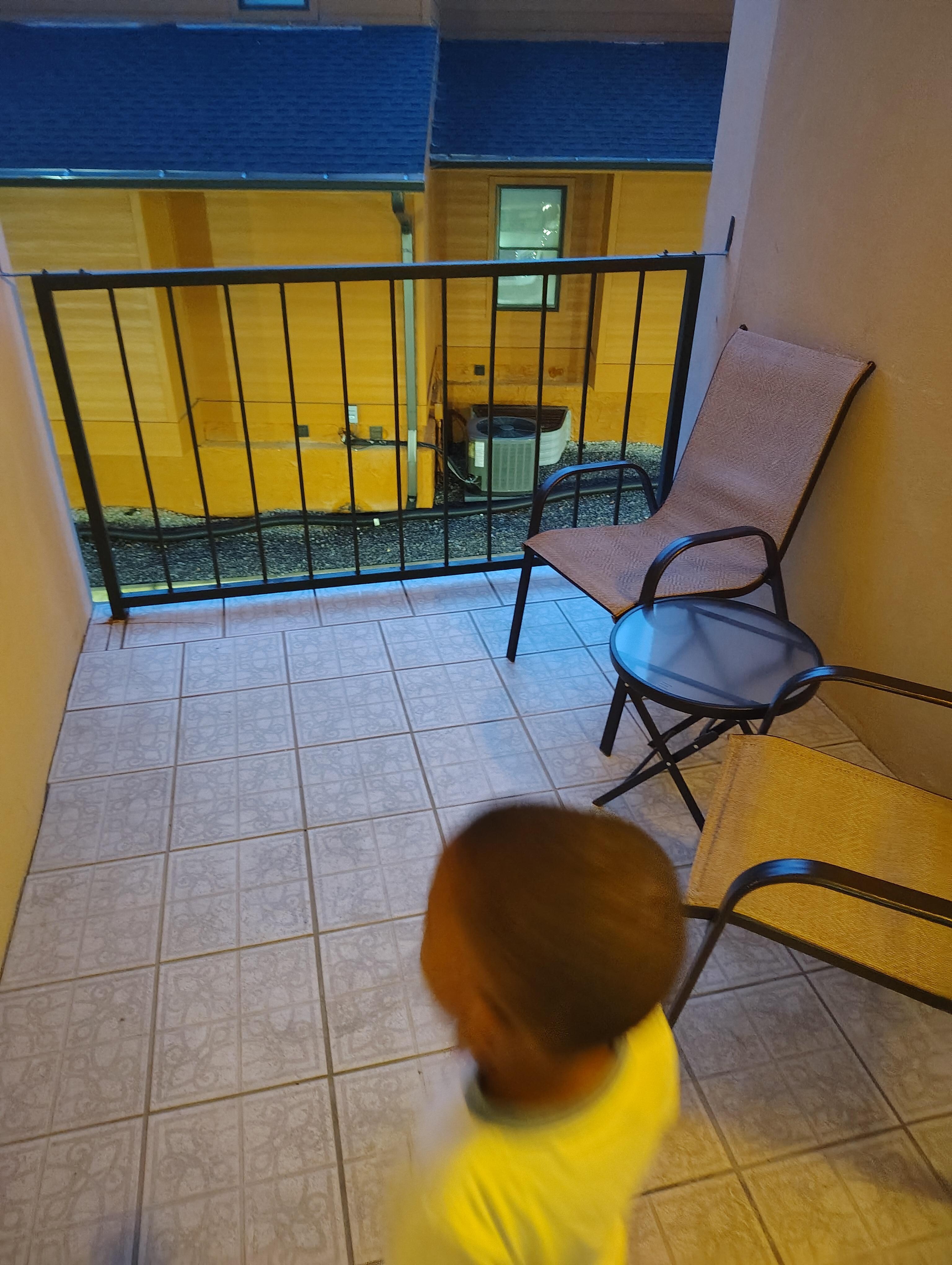 My son checking out the balcony