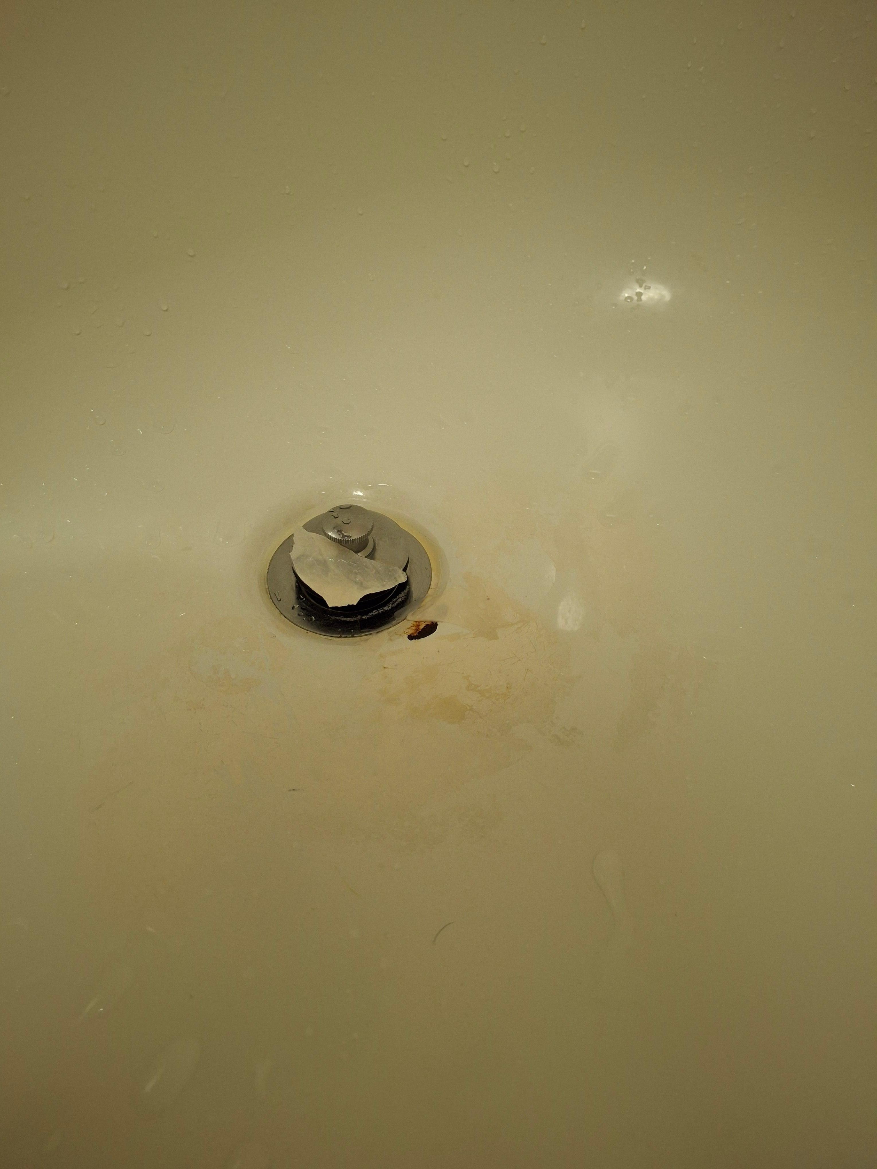 "Patch" around the drain was peeling off.