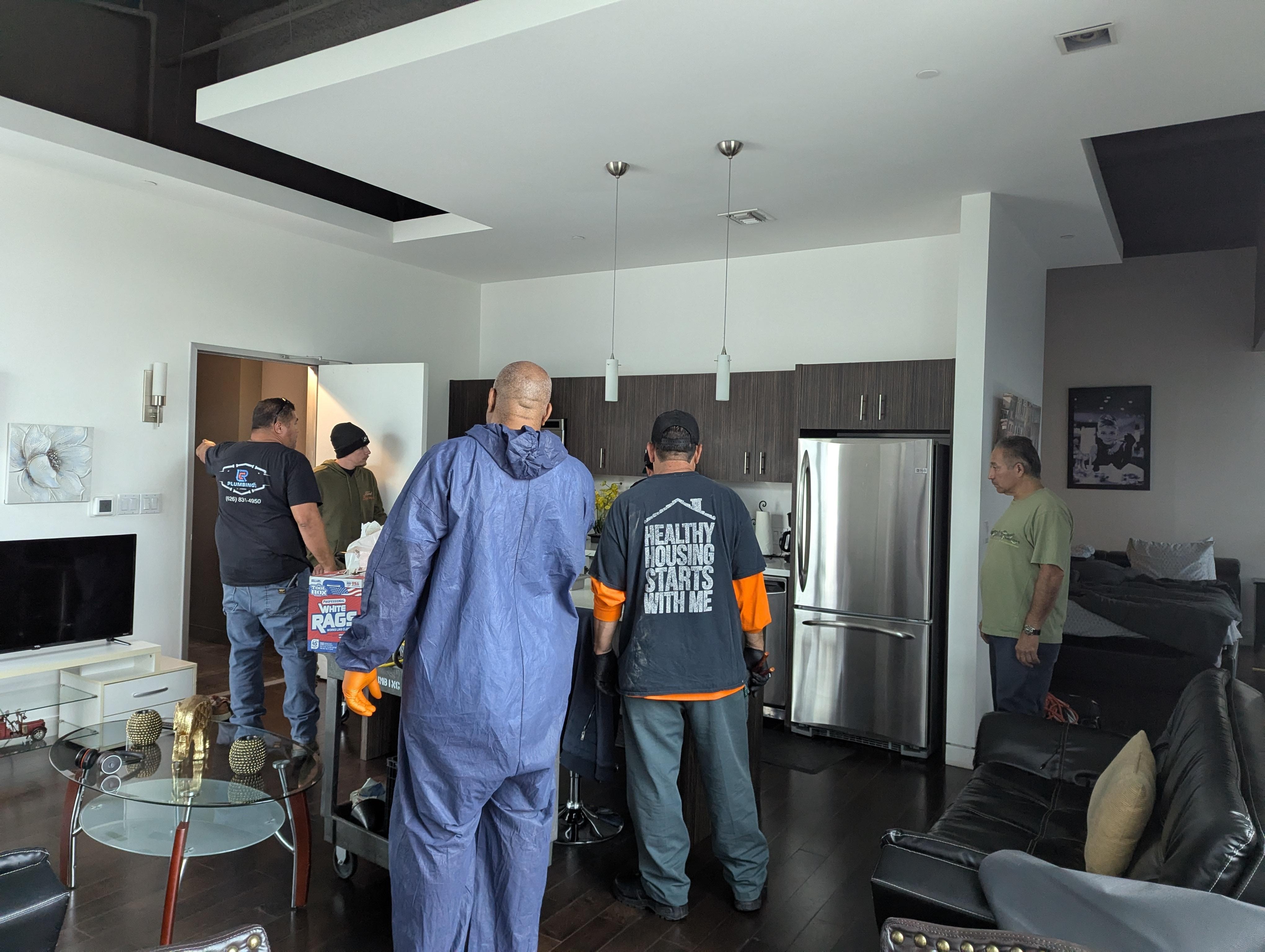 Six of the men that entered the apartment without prior notice. There were more in the bathroom.