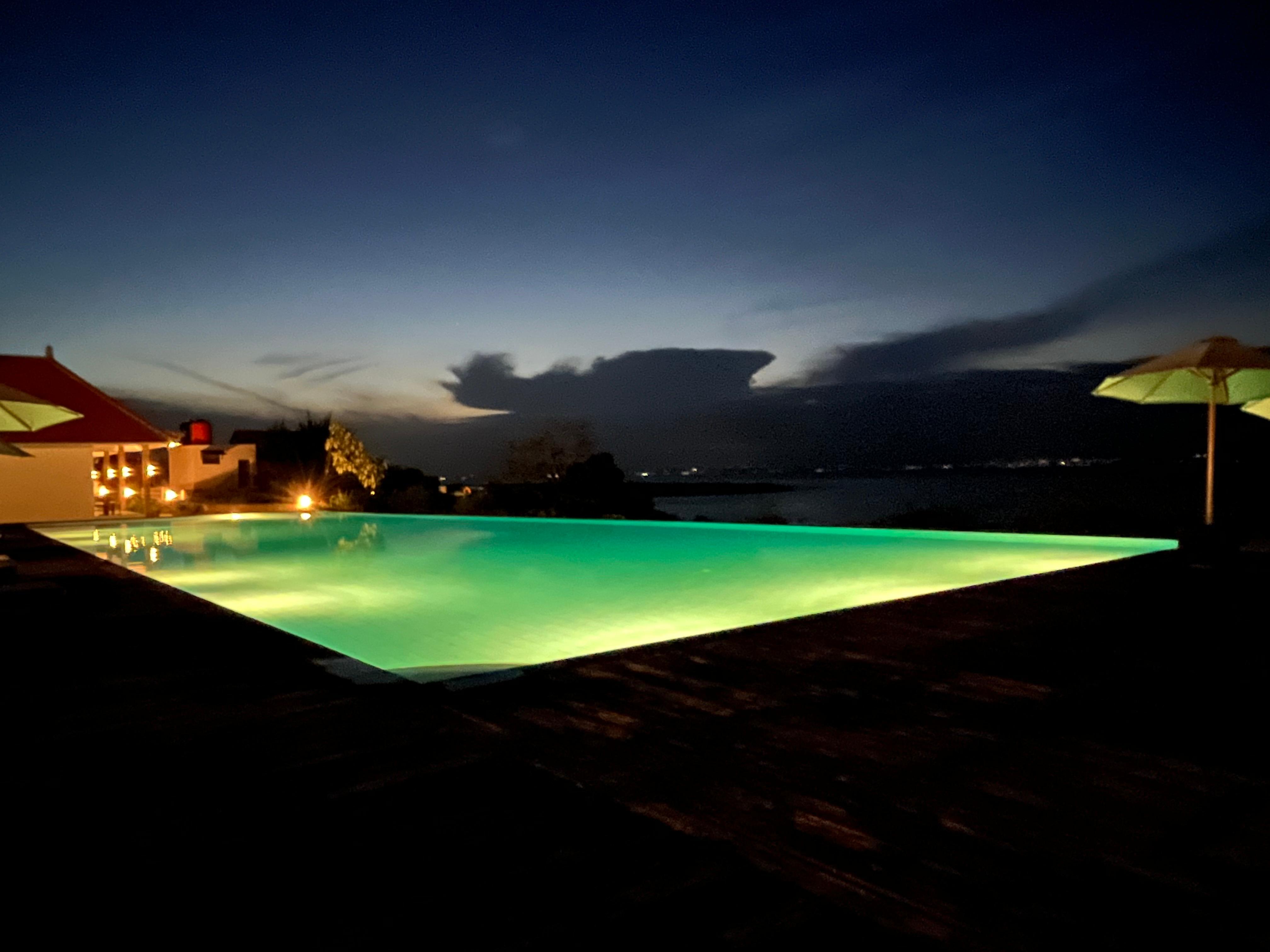 Infinity pool lit at night