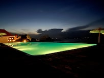 Infinity pool lit at night