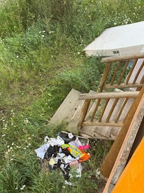Garbage beside the staircase to greet as tou walk up.