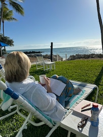 Enjoying coffee and reading by the water