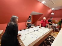 Air hockey with the grandparents!