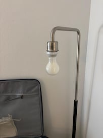 The lamp with the missing lampshade.