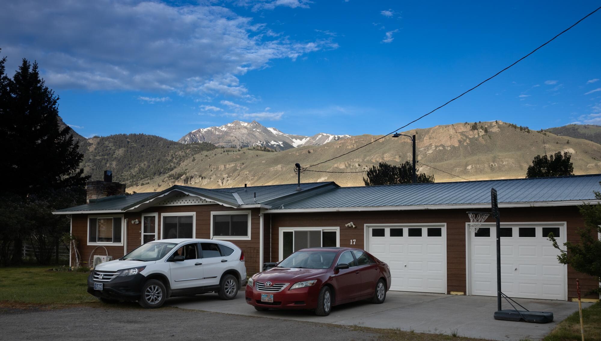 Plenty of parking on the front of this massive property. The neighbors are not really visible with lots of trees surrounding the acreage. 
