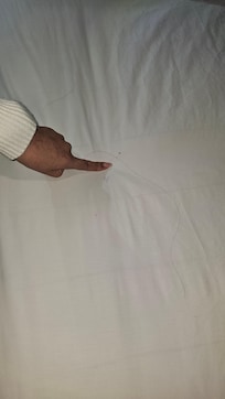 Stains on the bed sheets hair in the bed. another guest was at the check in counter complained about roaches in their room