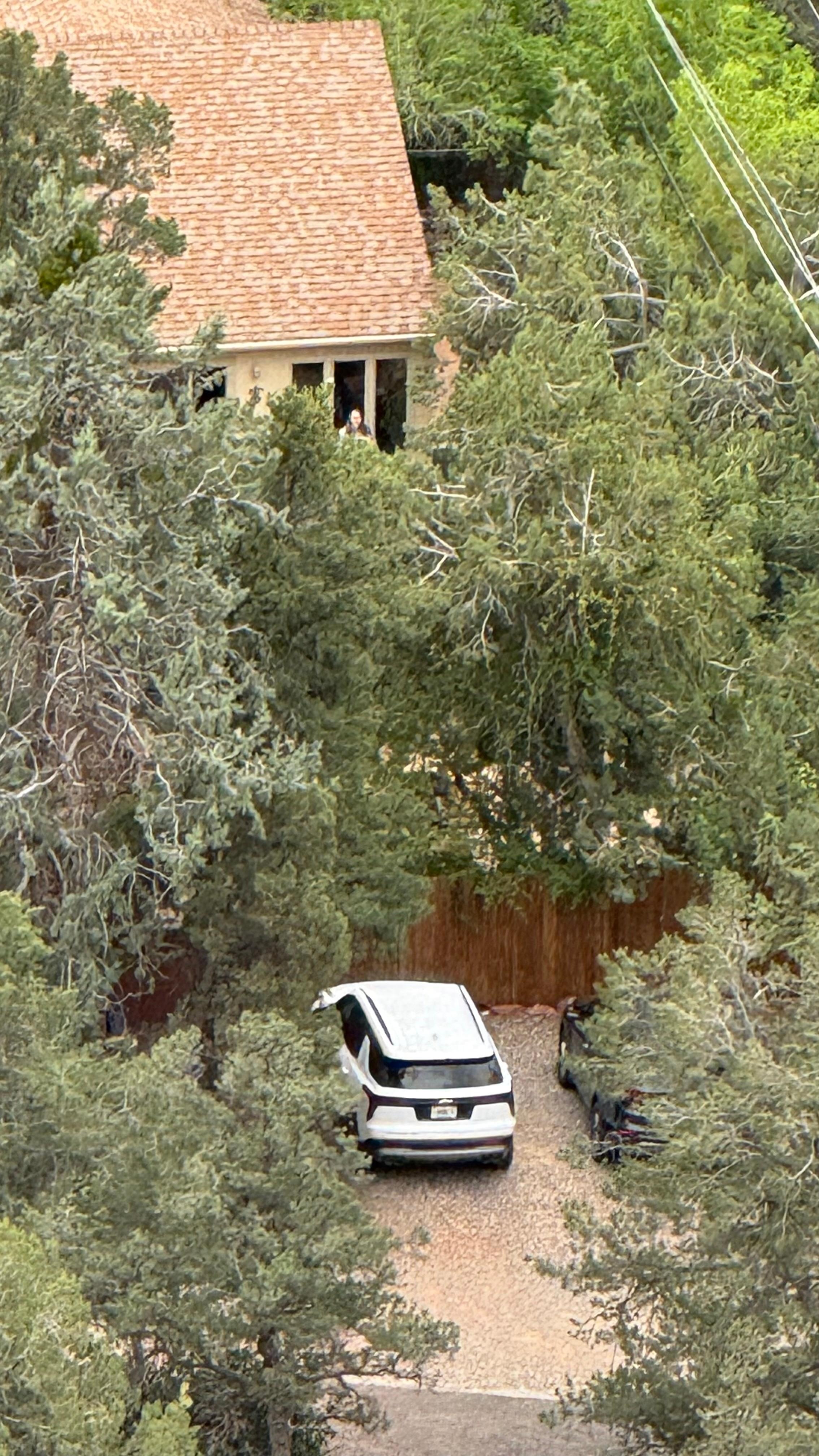 Zoomed in with phone and can see the house