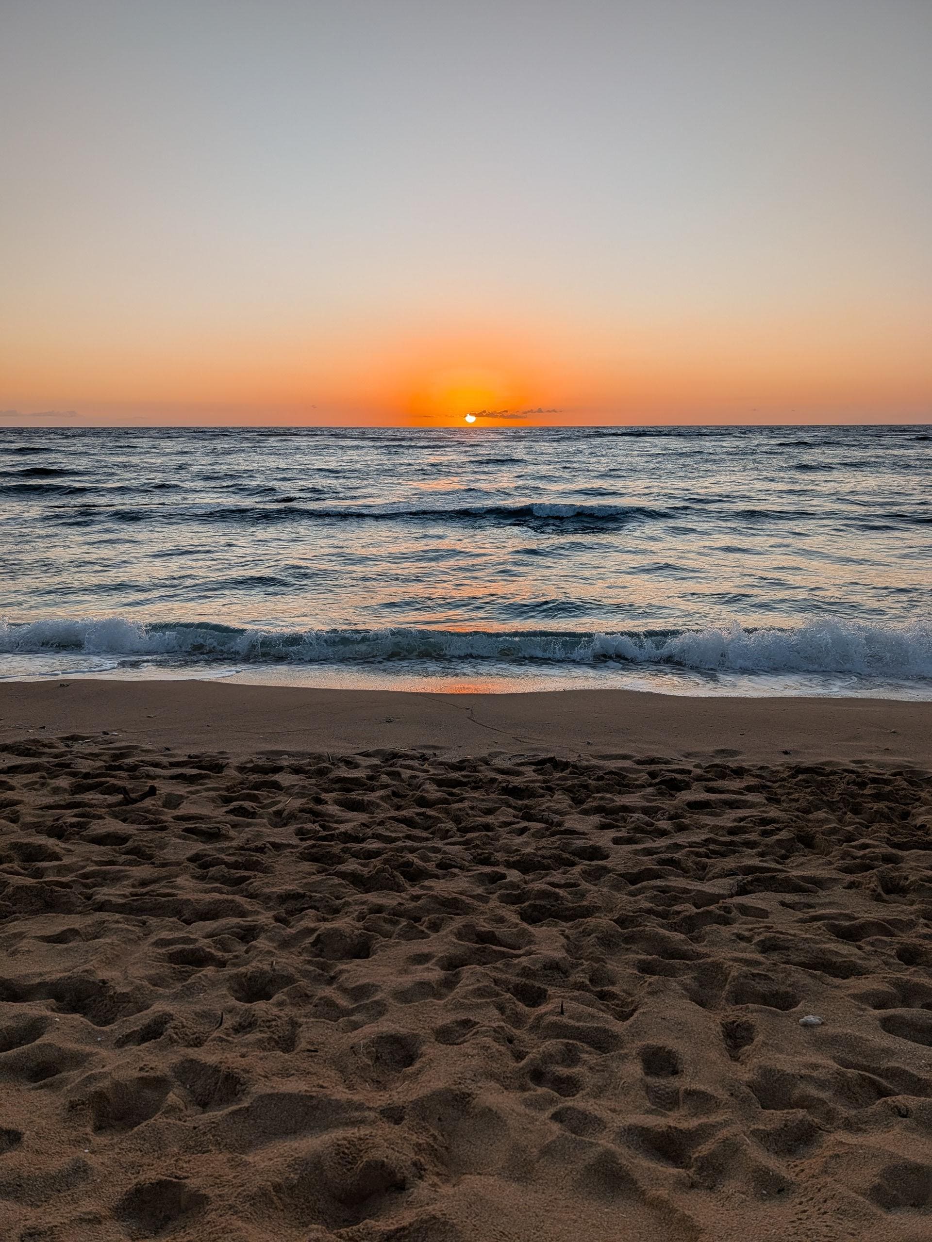 beautiful sunrise on the beach at the resort