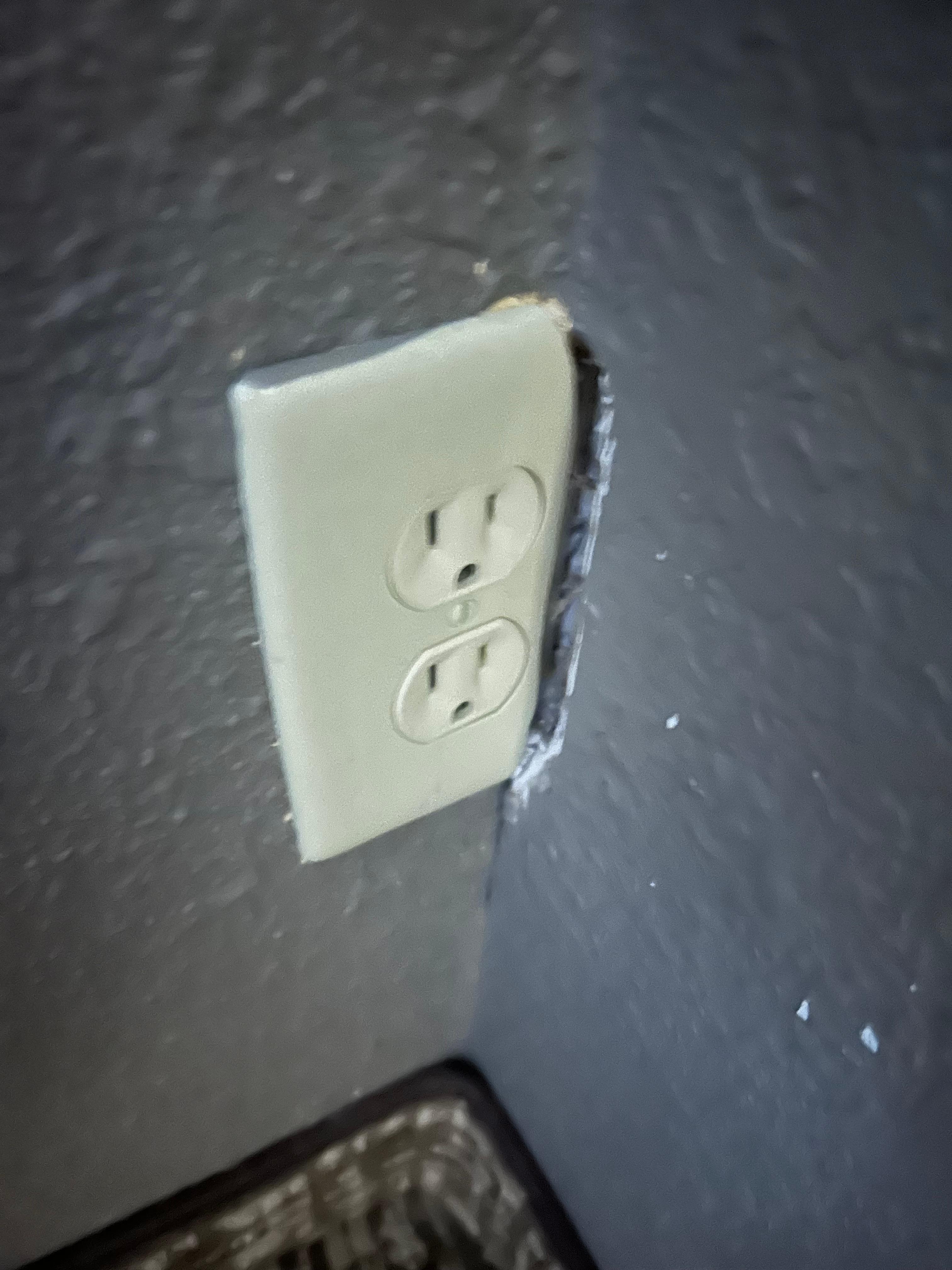 Cheaply installed outlet with hole next to it