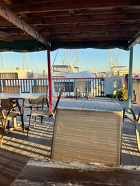 Very close place to eat. Sitting at table with boat in view.