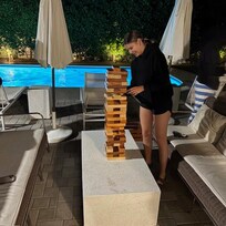 Playing Jenga in the evening by the pool!