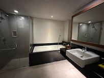 First photo of bathroom, looks spacious. No close up photo of moulds in shower