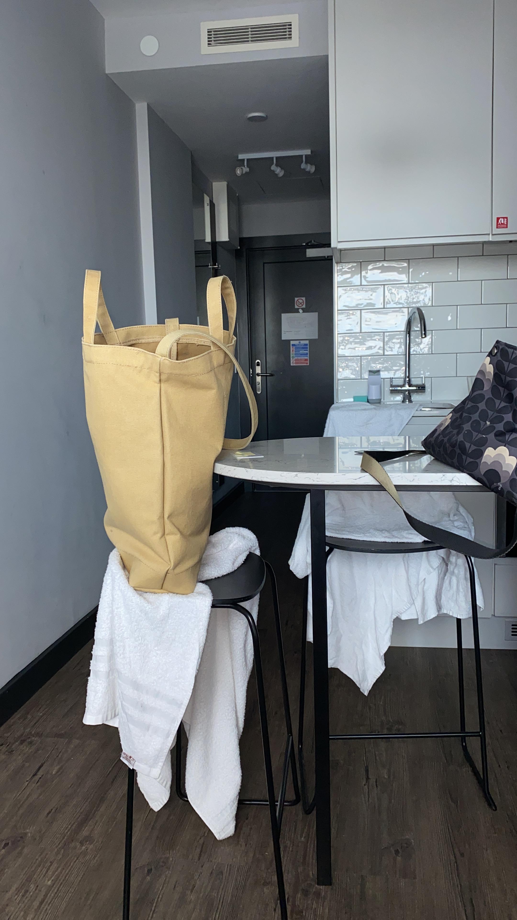 Nowhere to put towels except on stools. 