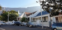 Street outside hotel entrance with Table Mountain view