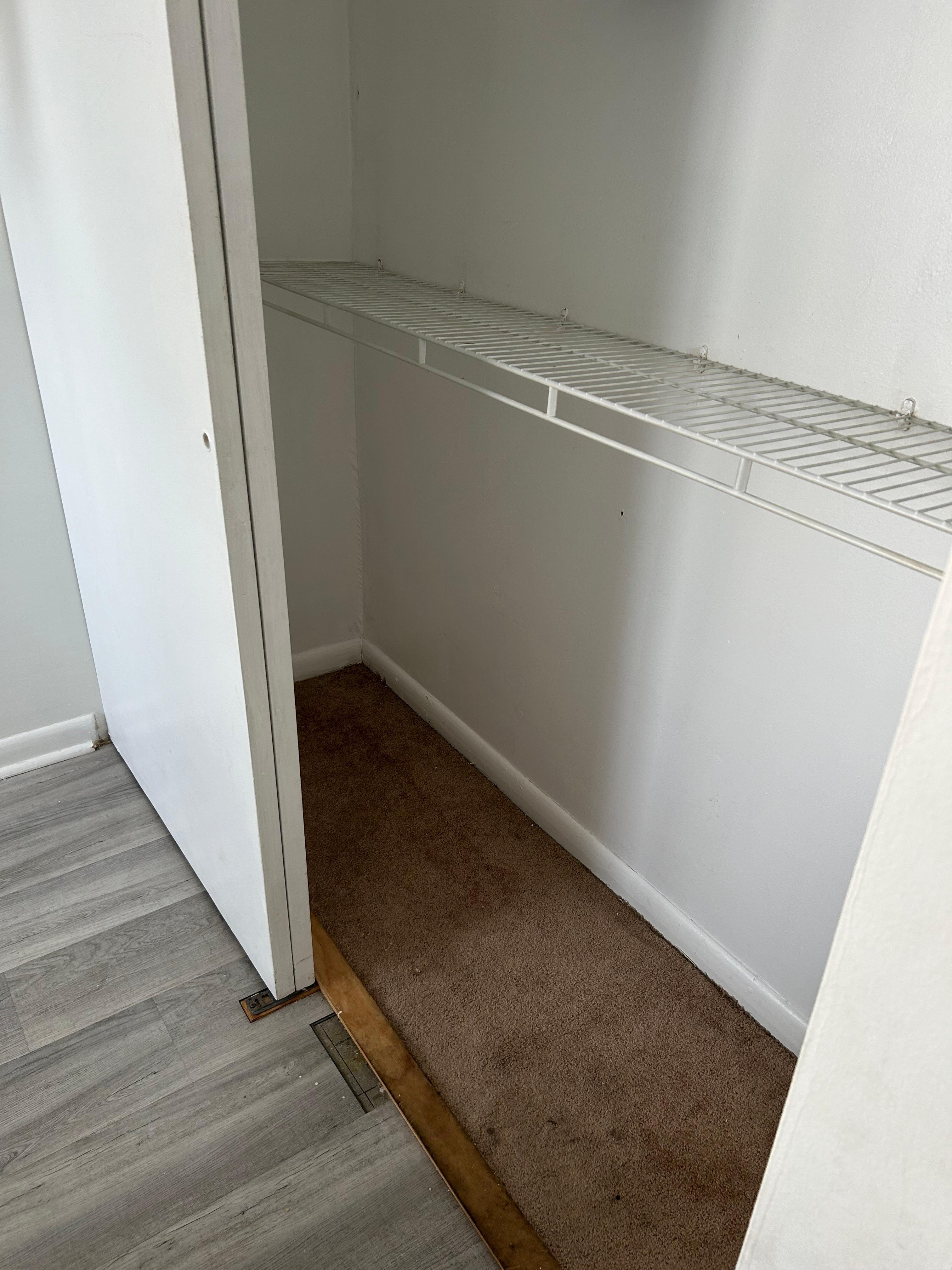 Missing floor pieces, closet not very nice. 