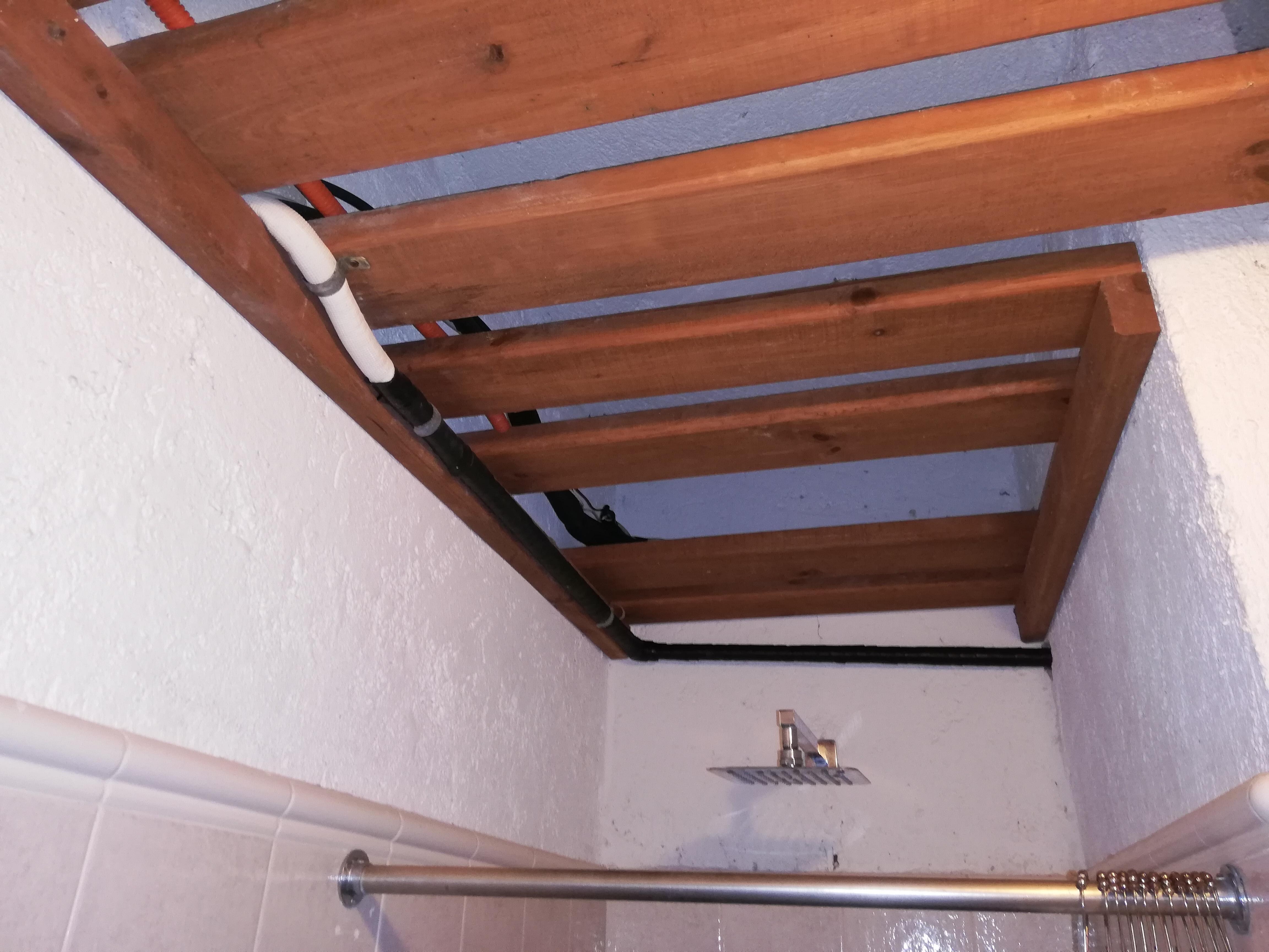 Rain shower, open ceiling with pipework