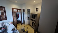 From back corner to bathroom, shower, and TV