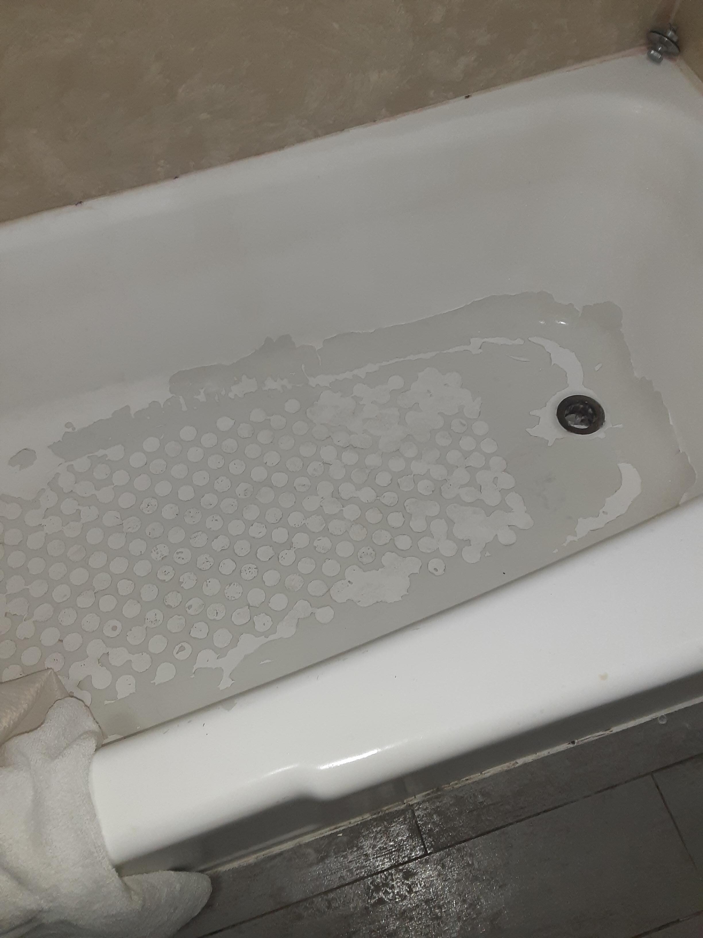 the bottom on the tub where they removed a mat and took a lot of the enamel with it
