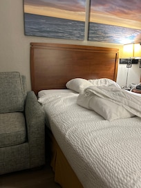 Sofa against this side of the bed making access a little tricky