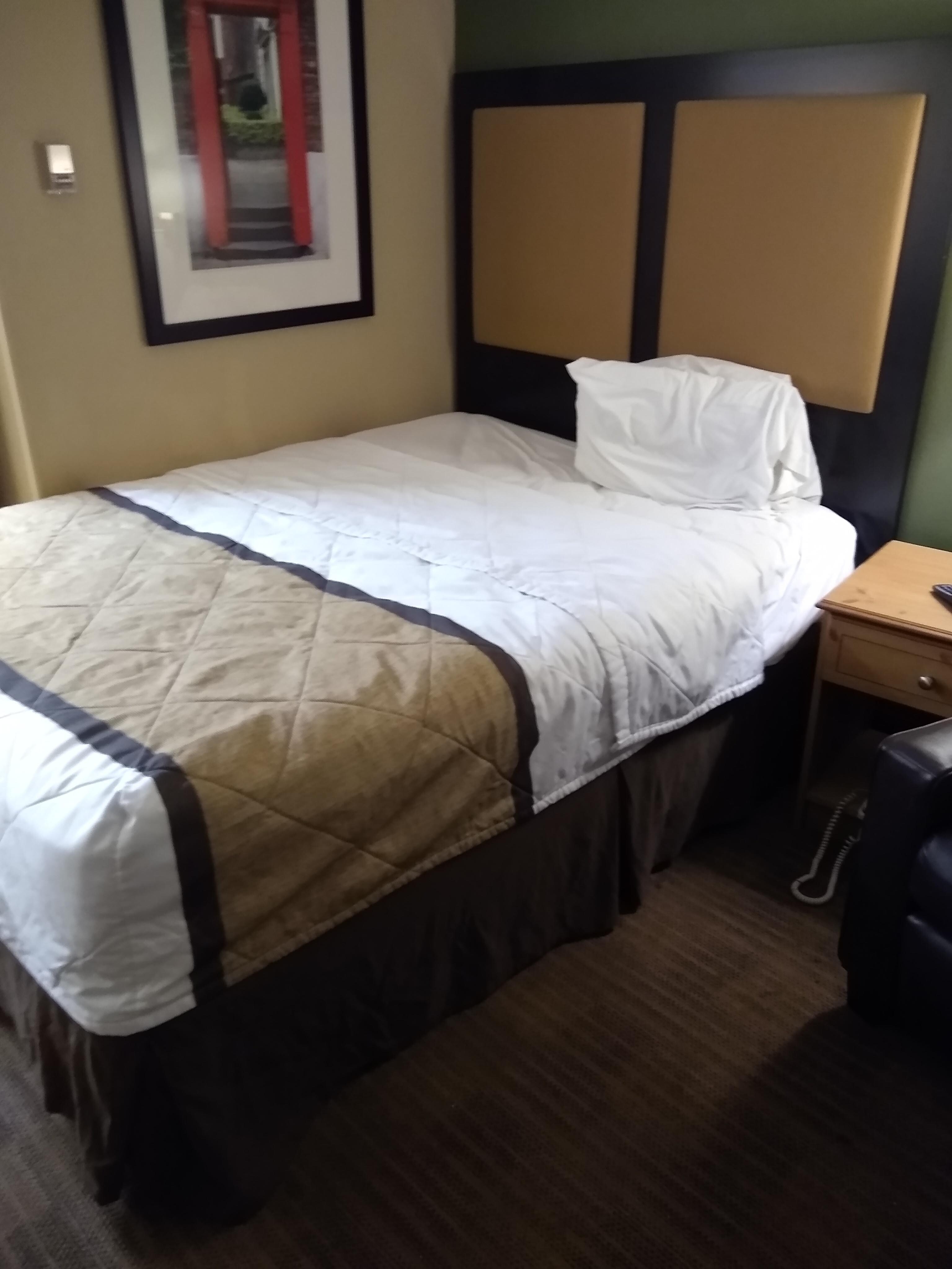 The bed that someone was laying in before I got the room