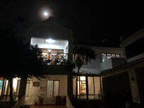 Almost full moon — back of lodge