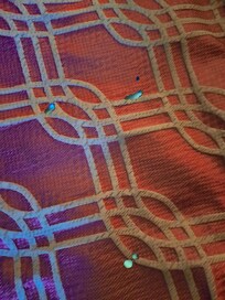 Cigarette burns on every fabric in the room.