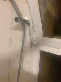 Knife stuck into shower fitting