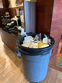 Trash containers are improvised during breakfast