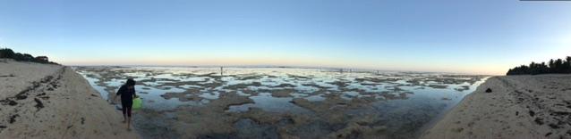 At low tide. Beach is sandy and soft, great for walking the >3km of beach