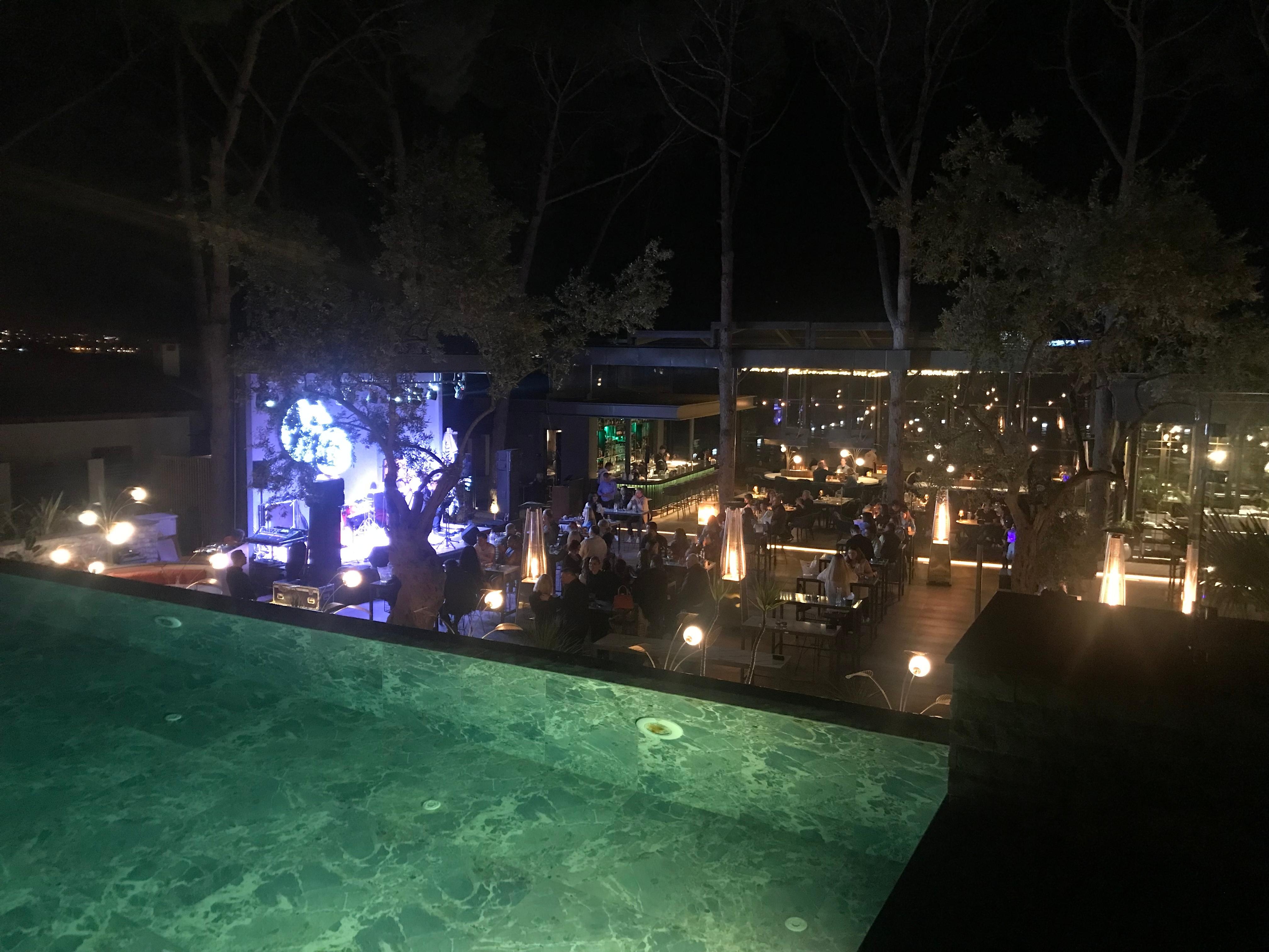 View from the pool area to the stage and bar area