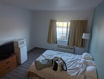 No furniture except 2 beds, dresser, night stand, tv, refrigerator & microwave.