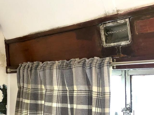 Covered in mold, this is the window next to the bed.