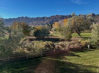 The views include both the golf course (other side of the fence) and the mountains!