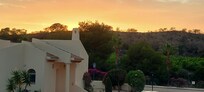View/sunset from apartment balcony.
