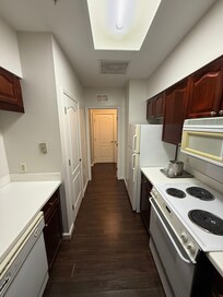 Dated appliances in yellow plastic throughout.