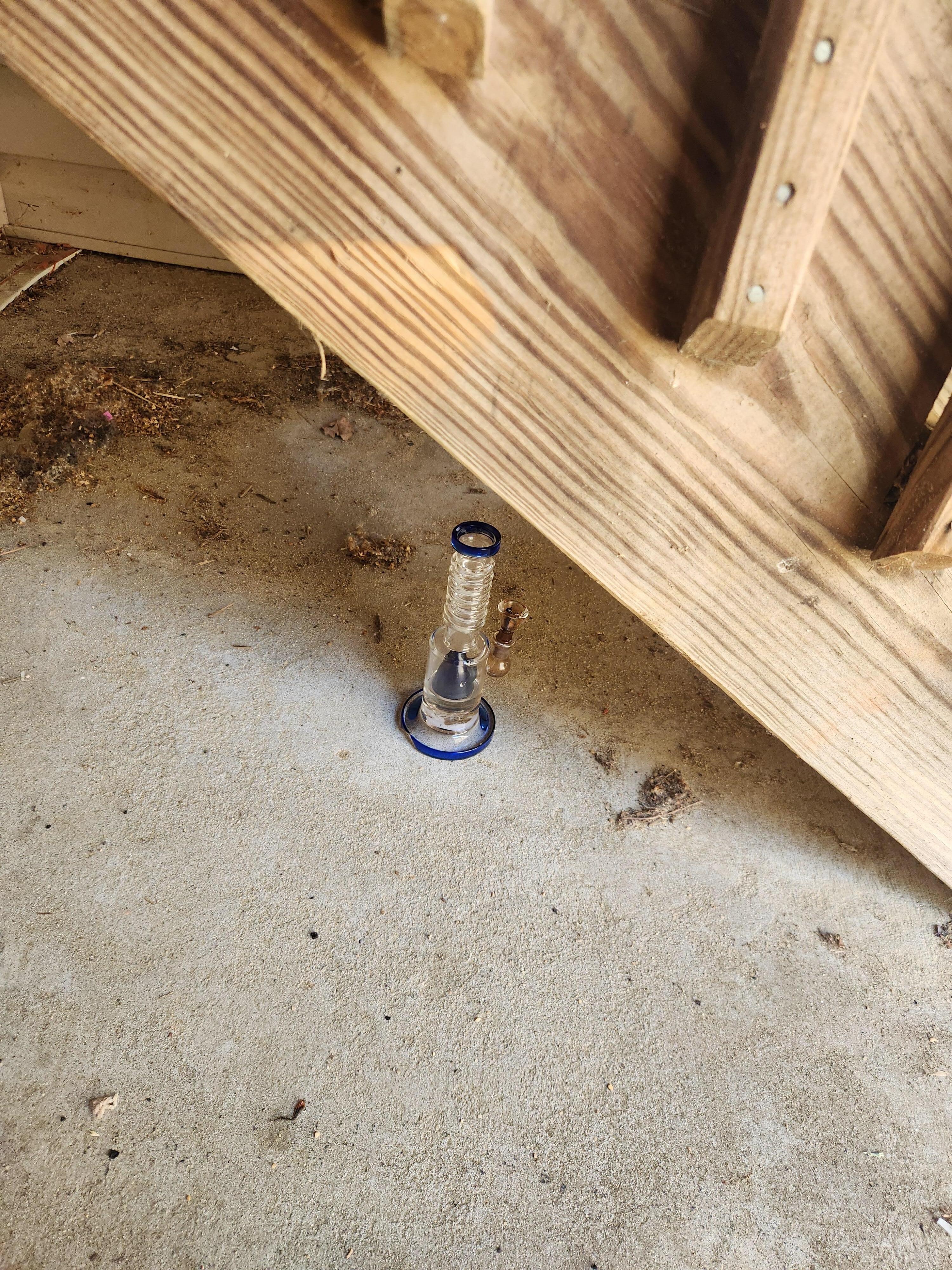 Weed pipe under the exterior steps.