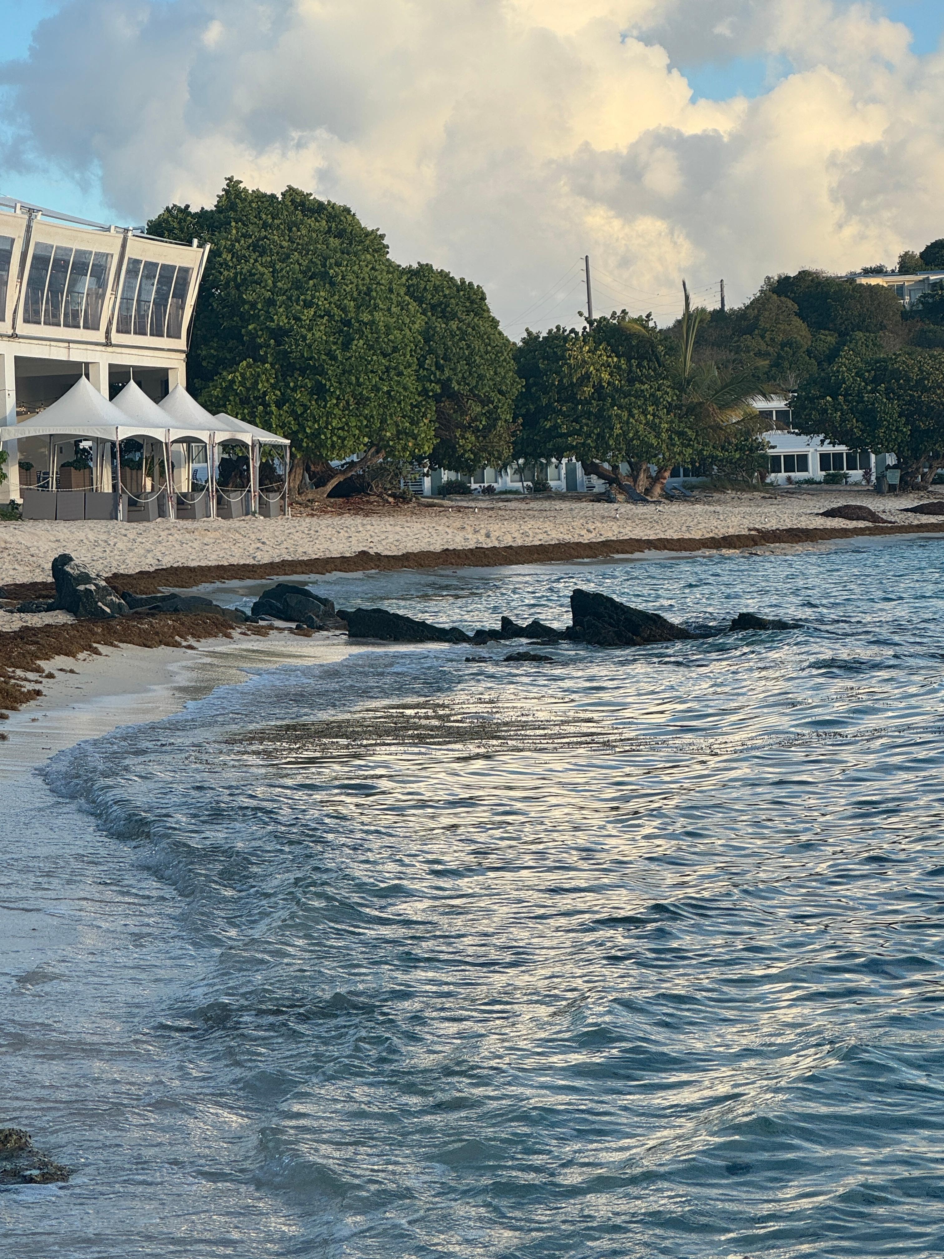 A view of the beach bar and restaurant from the beach in front of the unit.