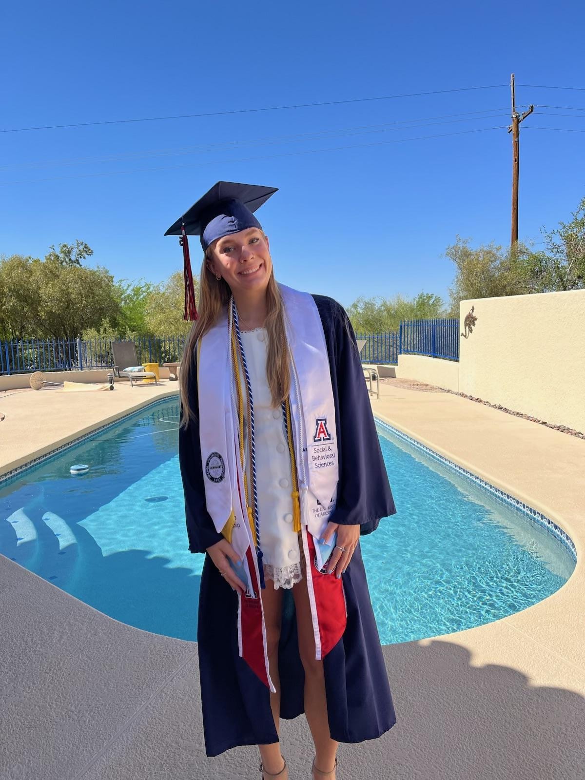 Graduate by the pool 