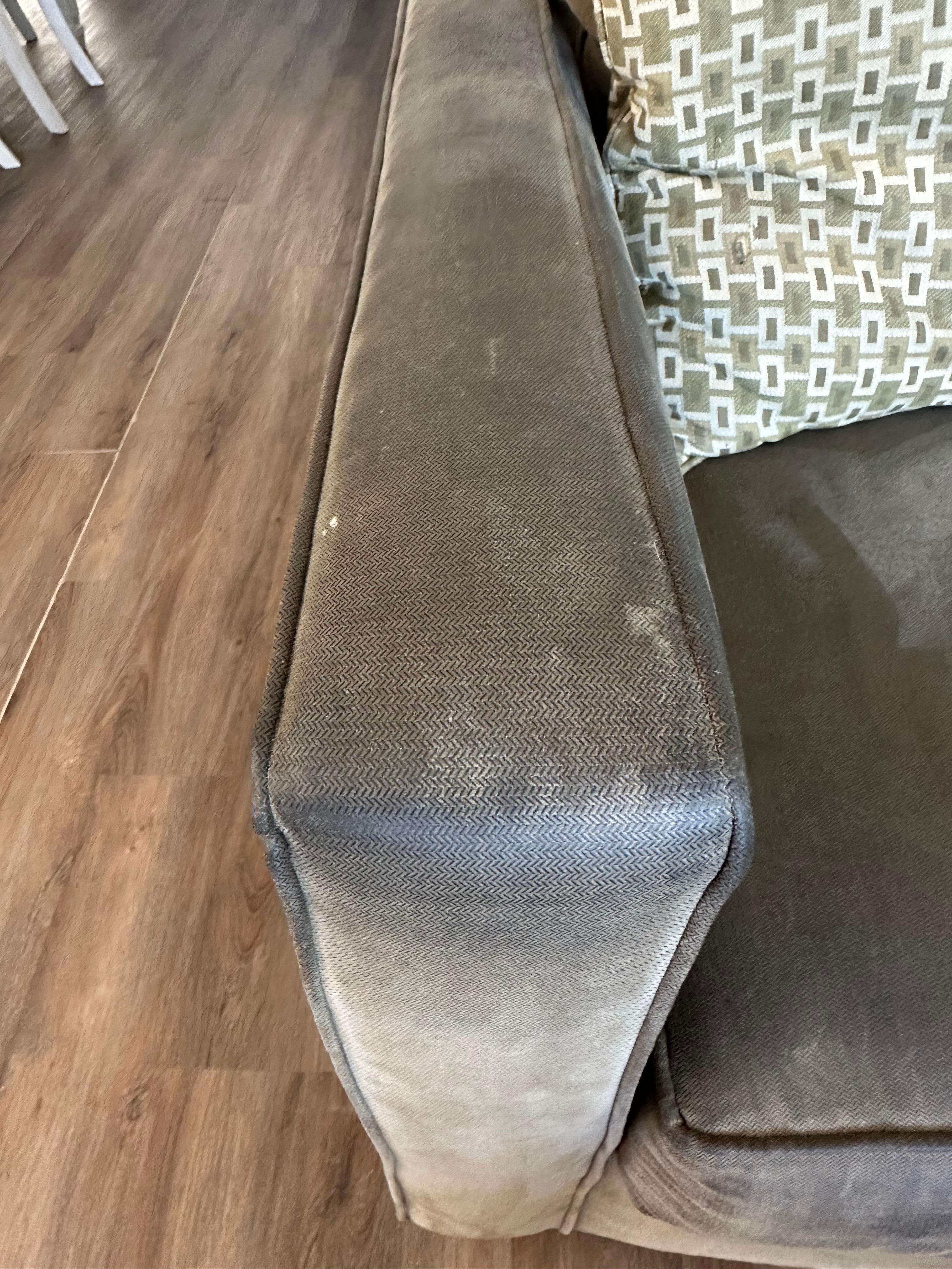 Very dirty couch in living room. 